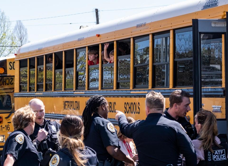 PHOTO: School buses with children arrive at Woodmont Baptist Church to be reunited with their families after a mass shooting at The Covenant School, March 27, 2023, in Nashville, Tenn. (Seth Herald/Getty Images)