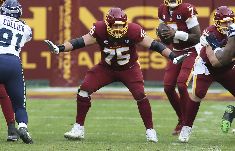 FILE - In this Sunday, Dec. 20, 2020, file photo, Washington Football Team offensive guard Brandon Scherff (75) blocks during an NFL football game against the Seattle Seahawks in Landover, Md. On Monday, March 8, 2021, Washington announced they've placed the franchise tag on guard Brandon Scherff for a second consecutive year. Scherff is coming off his first All-Pro season. (AP Photo/Daniel Kucin Jr., File)