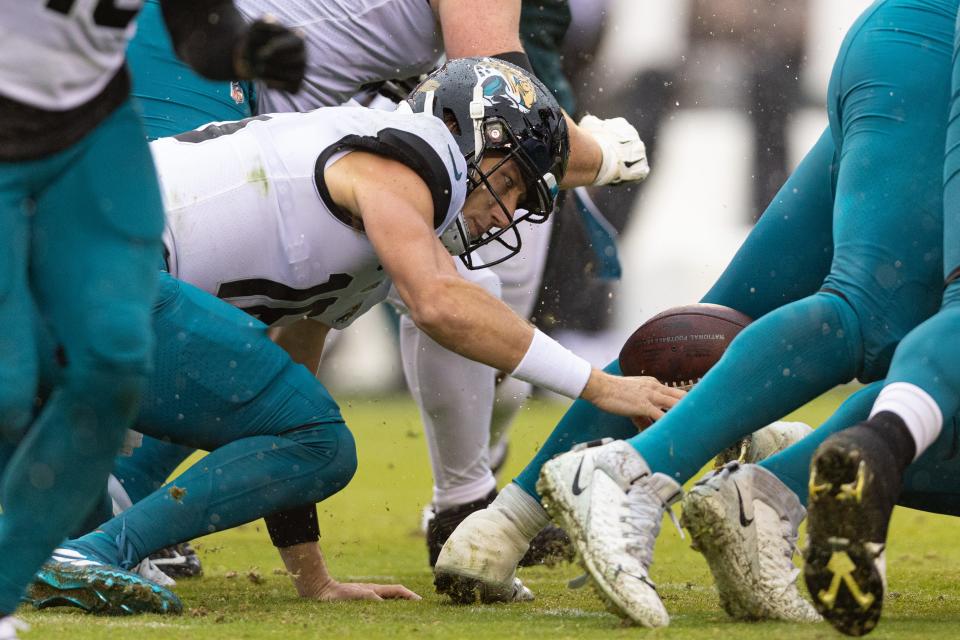 Jaguars quarterback Trevor Lawrence loses the handle on one of his four fumbles on Sunday in a 29-21 loss to Philadelphia, at Lincoln Financial Field.