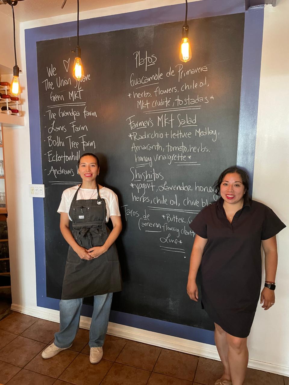 Joana Herrara, left, with her sister Sheena Garcia at Mariachi Mexico. The two own the Armonk restaurant and source from local farmers, outlined on the blackboard. Photographed July 6, 2023