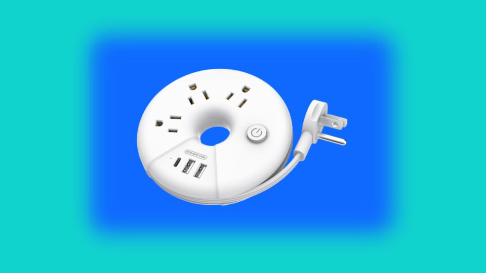 Circular power strip against blue and green background.