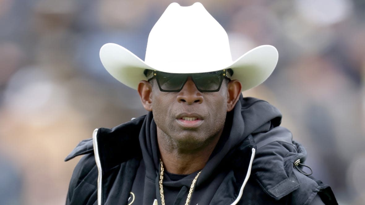 Head coach Deion Sanders of the Colorado Buffaloes watches his team warm up prior to an April game at Folsom Field in Boulder, Colorado. One of the newest additions to his squad, it was announced recently, is Nahmier Robinson, son of Nate Robinson. (Photo: Matthew Stockman/Getty Images)