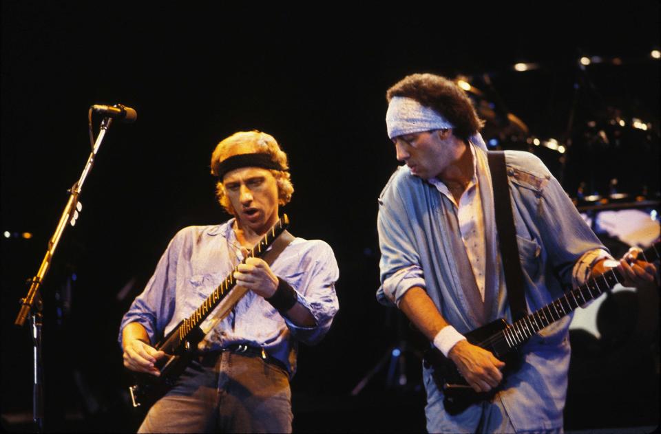 Mark Knopfler and Jack Sonni of Dire Straits perform in this undated photo. (Photo: Ebet Roberts via Getty Images)