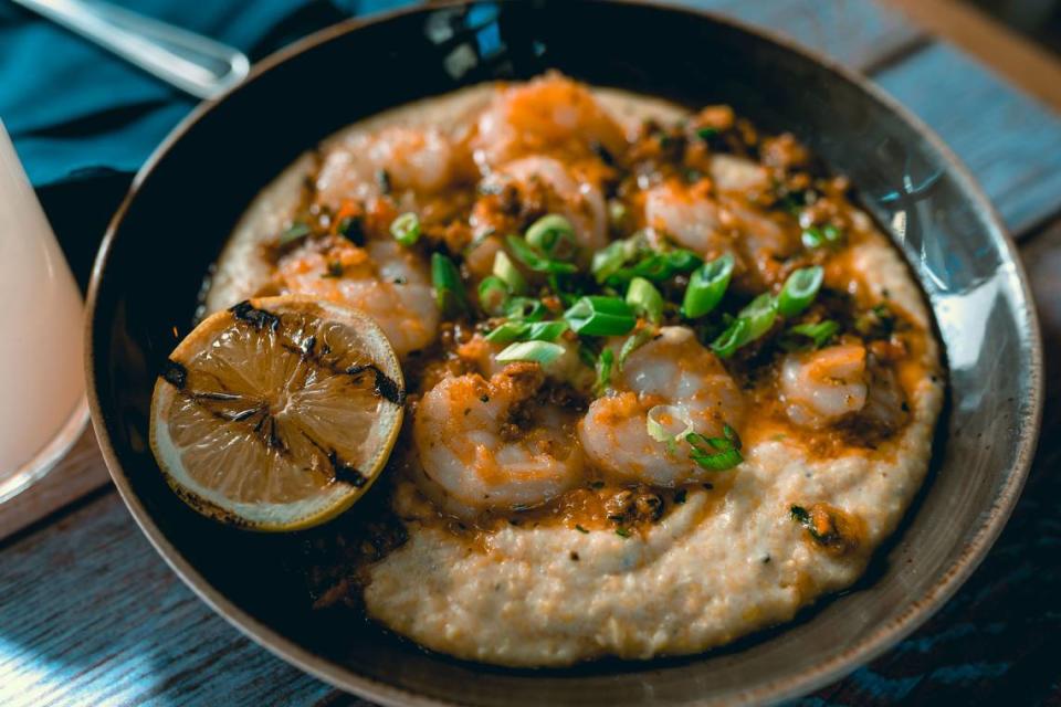 Tupelo Honey’s Shrimp & Grits entree is made with sustainably wild-caught white gulf shrimp, chorizo pork sausage, peperonata, Creole sauce, scallions, heirloom grits with goat cheese.