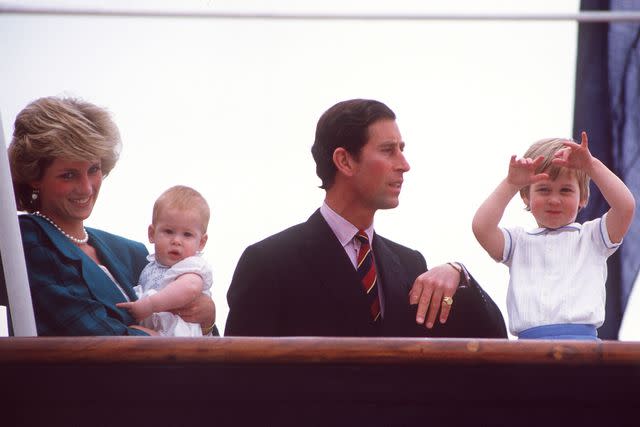 <p>Diana Archive/Getty</p> Princess Diana, Prince Harry, Prince Charles and Prince William leave Italy on the Royal Yacht Brittania in 1985.