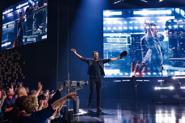 <p>John Shearer/Getty</p> Luke Bryan performs during the opening night of his residency at Resorts World Las Vegas on February 11, 2022 in Las Vegas, Nevada.