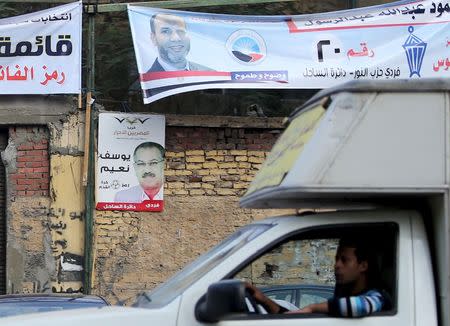 Electoral banners for the Salafist political party "al-Nour" (top) are seen in Shubra area in Cairo during the second day of the second round of Egypt's parliamentary elections, Egypt, November 23, 2015. REUTERS/Mohamed Abd El Ghany