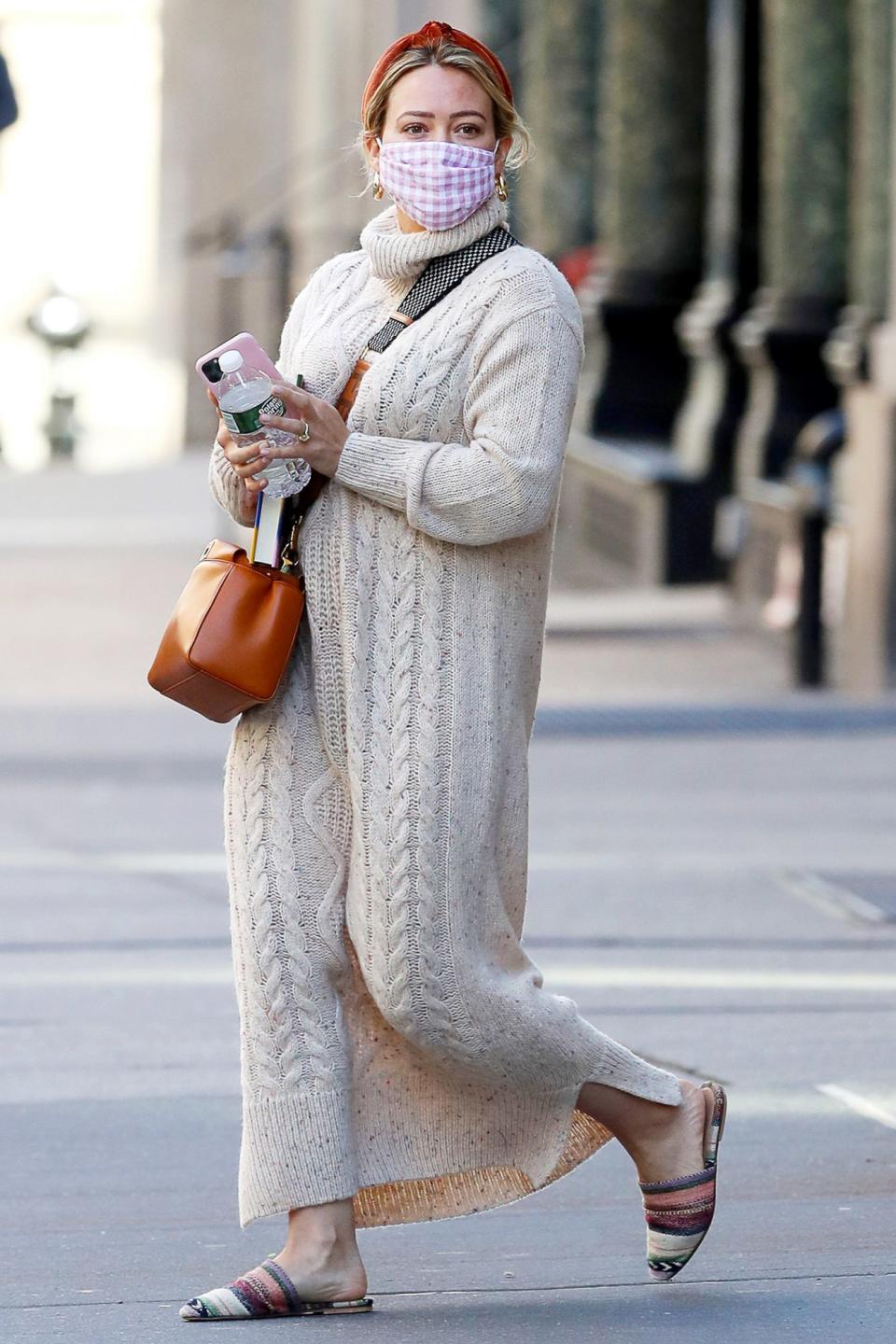 <p>Hilary Duff wore a tan knit sweater dress on her walk through N.Y.C. on Saturday.</p>