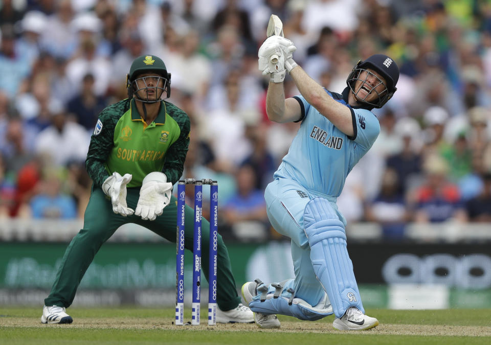 England's captain Eoin Morgan plays a shot for six off the bowling of South Africa's Aiden Markram during the World Cup cricket match between England and South Africa at The Oval in London, Thursday, May 30, 2019. (AP Photo/Kirsty Wigglesworth)