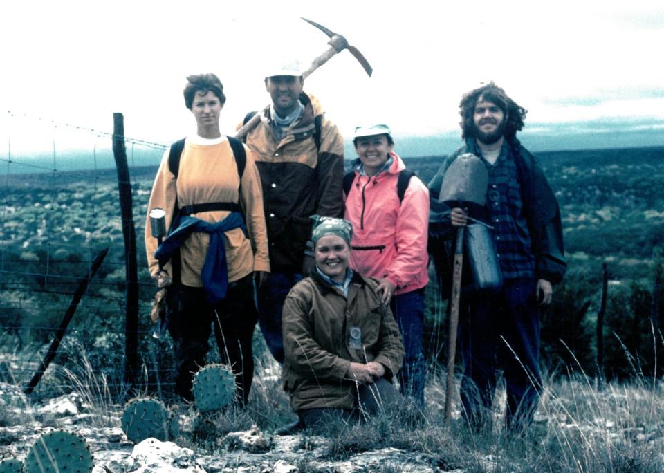 Texas archaeologist Margaret Howard (pink jacket) with a team surveying the Devil's Sinkhole in 1995.