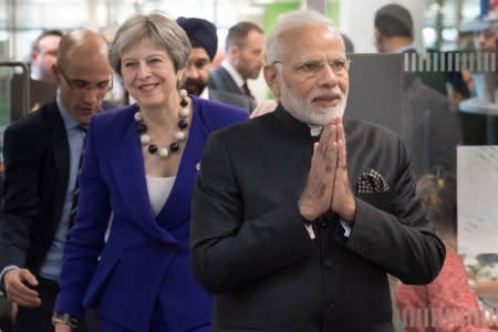 Britain's Prime Minister Theresa May and India's Prime Minister Narendra Modi visit the Francis Crick Institute in London, April 18, 2018.   Stefan Rousseau/Pool via Reuters