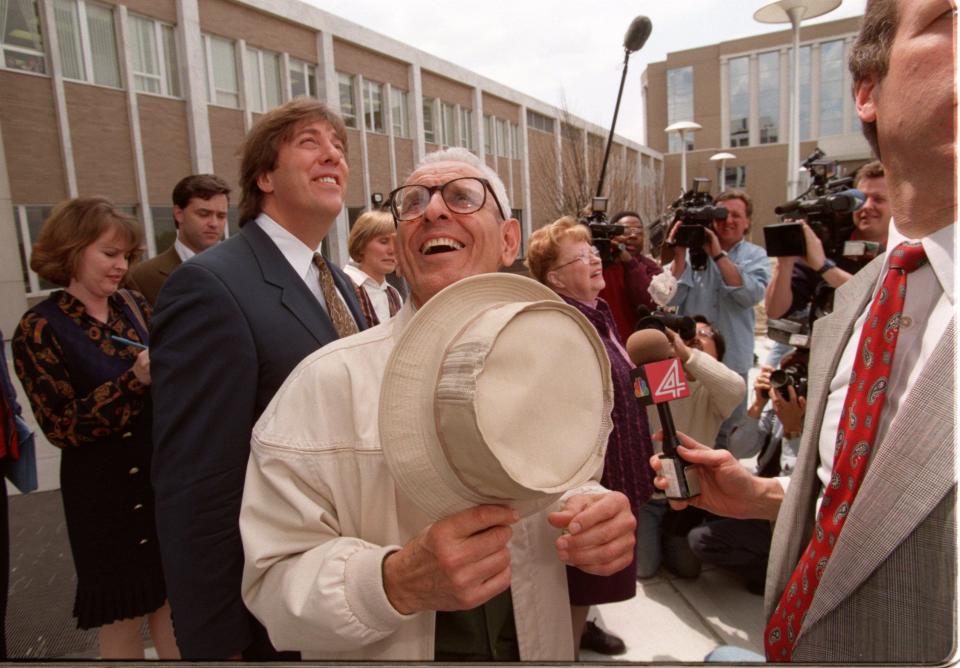 Jack Kevorkian smiles along with his attorney Geoffery Fieger, (left) as they watch a symbolic release of 28 ballons representing all of Kevorkian's patients after the verdicts of not guilty were handed down by an Oakland County jury in the assisted suicide cases against Kevorkian.