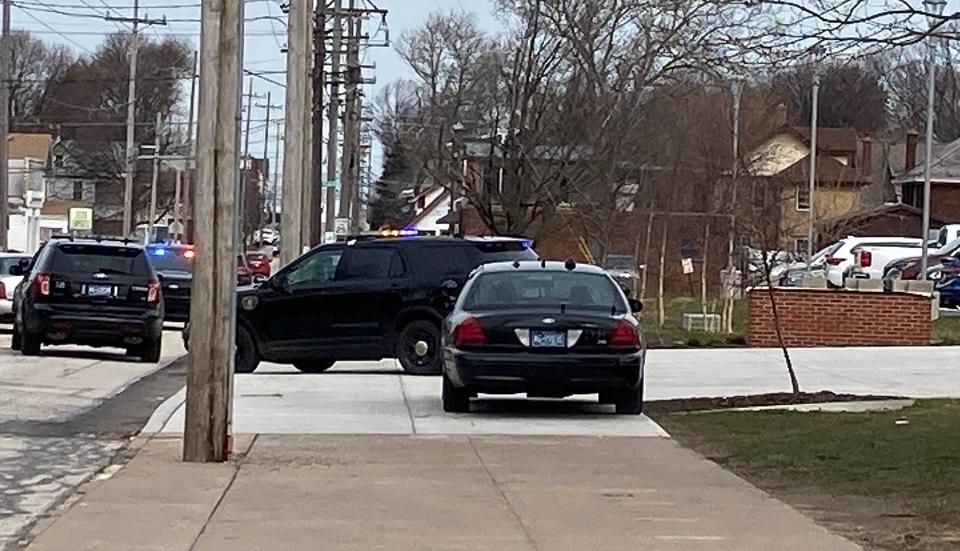 Erie police cars leave Erie High School shortly before 11:15 a.m. on Wednesday, March 29, 2023, after responding to report of a shooting at the school that turned out to be a hoax. Police were at Erie High for about a half hour.