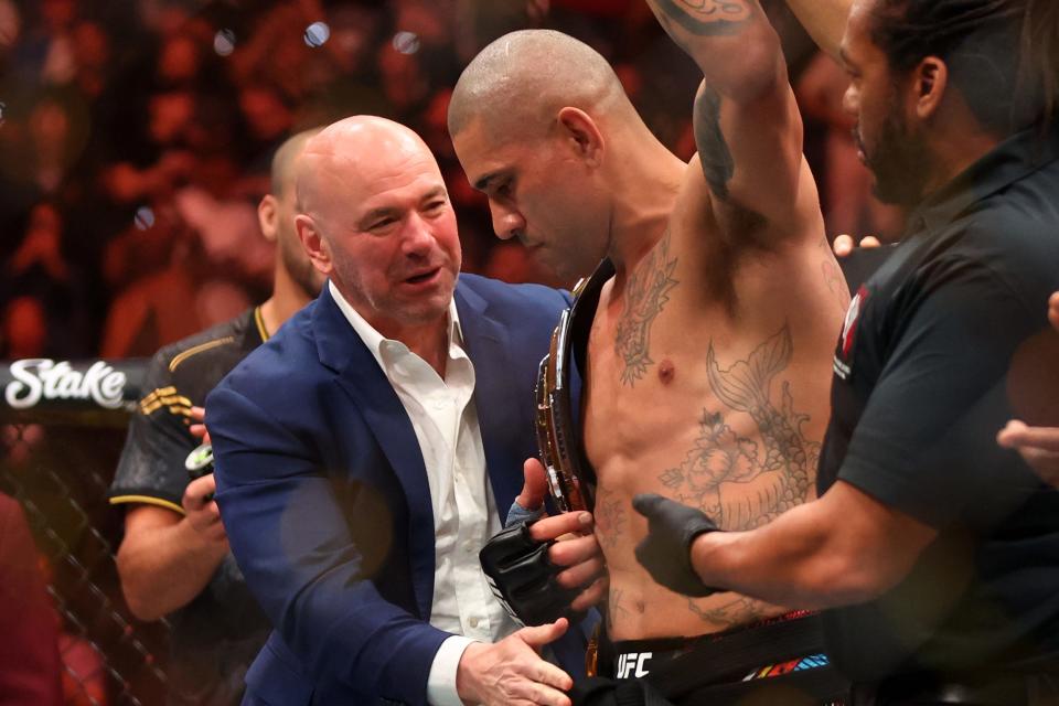 Apr 13, 2024; Las Vegas, Nevada, USA; UFC president Dana White puts the championship belt on Alex Pereira after knocking out Jamahal Hill (not pictured) during UFC 300 at T-Mobile Arena. Mandatory Credit: Mark J. Rebilas-USA TODAY Sports