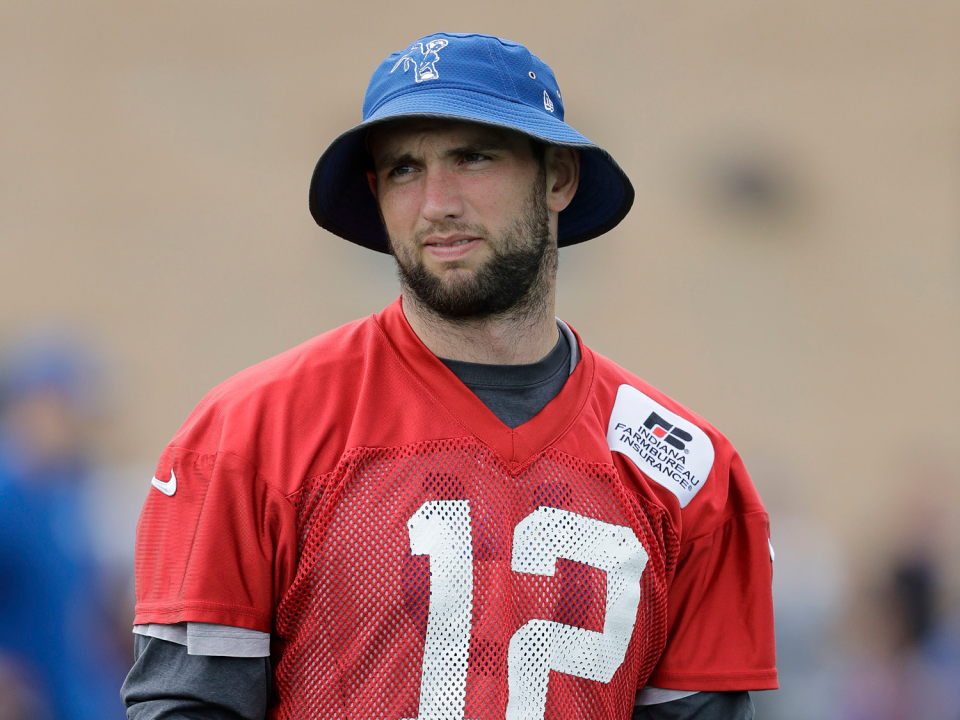 When will Andrew Luck trade in that hat for a helmet? (AP)