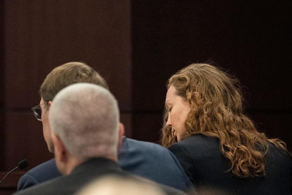 Kaitlin Armstrong sits with her attorneys after pleading not guilty on Wednesday, the first day of her murder trial. Armstrong is charged in the shooting death of pro cyclist Anna Moriah "Mo" Wilson.