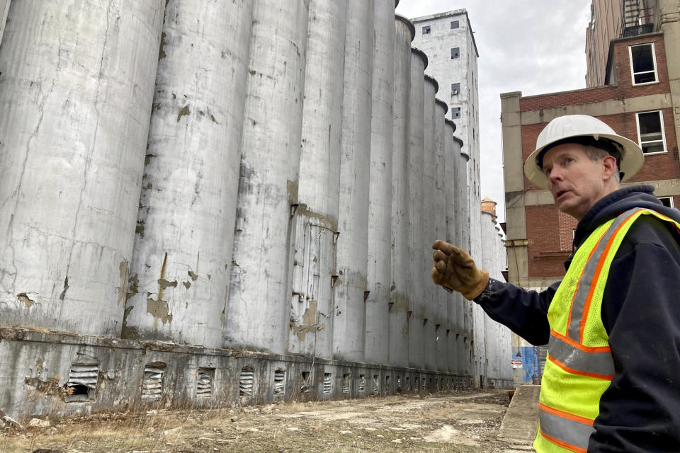 Chris Richmond, president of Moving Pillsbury Forward, the nonprofit formed to demolish and redevelop the former Pillsbury Mills plant in Springfield, Ill., discusses the 160 separate, 100-foot-tall silos that must be razed, Dec. 30, 2022. The silos are part of the 500,000 square feet of former mill that operated under Minneapolis-based Pillsbury and another owner for 71 years but has been vacant nearly a quarter-century. (AP Photo/John O'Connor)