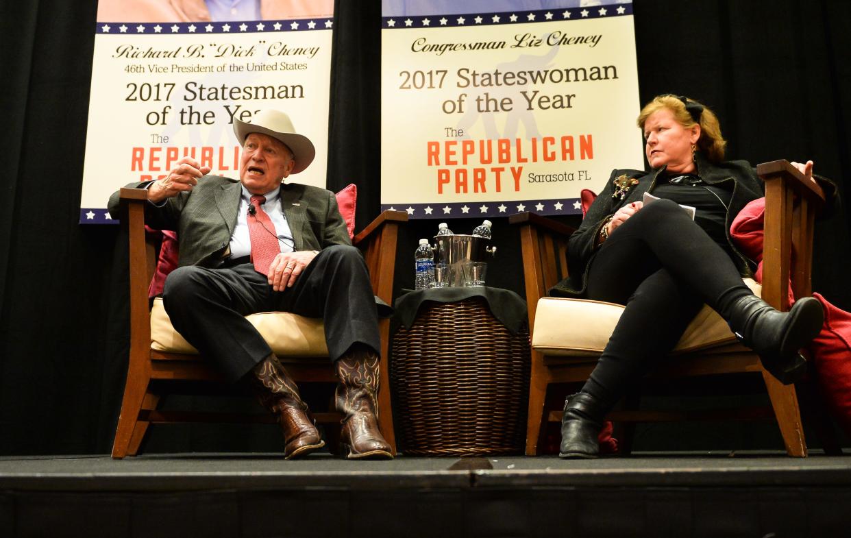 Former Vice President Dick Cheney speaks after receiving the "Statesman of the Year" award from the Republican Party of Sarasota County in 2018. Kathleen Shanahan, Cheney's former chief of staff, sits in the chair that was for Liz Cheney. Cheney was named that year as the "Chairwoman of the Year.'' Business in Washington D.C. prevented her from attending. Despite a banner saying otherwise, the RPOSC claims she was never honored.