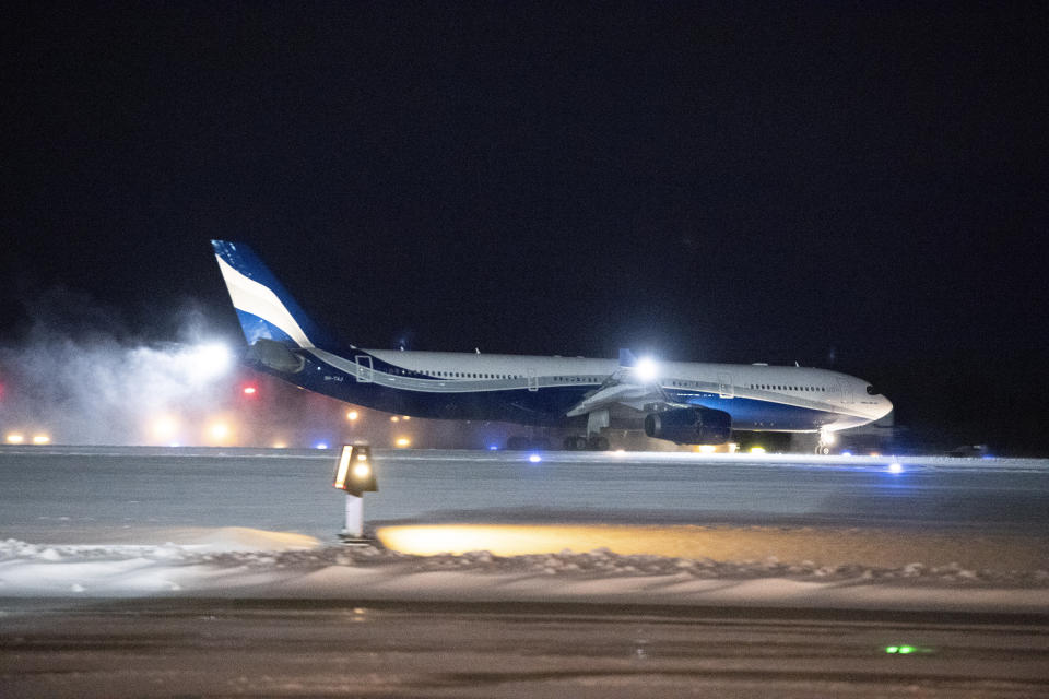 A plane carrying Canadians back Wuhan, China, lands at CFB Trenton, in Trenton, Canada Friday, Feb. 7, 2020. (Justin Tang/The Canadian Press via AP)
