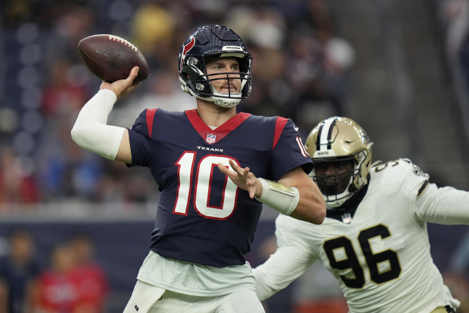 Houston Texans quarterback Davis Mills (10) is pressures by New Orleans Saints defensive end Carl Granderson (96) as the passes during the first half of an NFL preseason football game Saturday, Aug. 13, 2022, in Houston. (AP Photo/Eric Christian Smith)