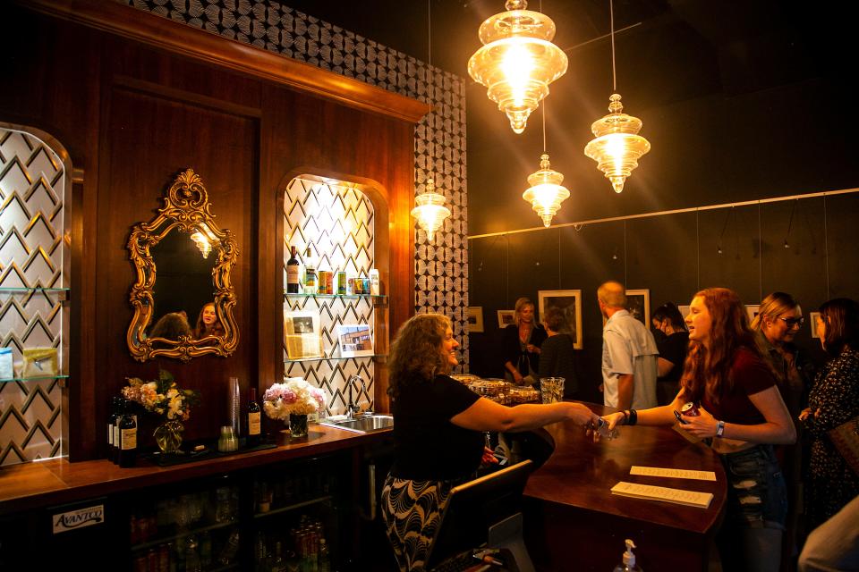 Guests get drinks from the lobby at the James Theater in Iowa City, Iowa.