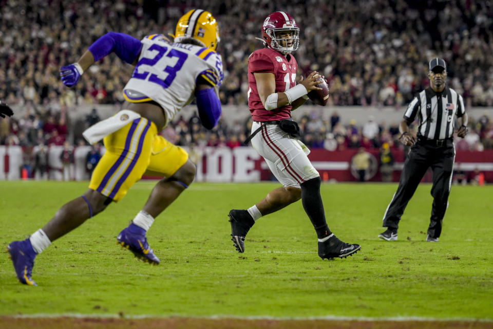 Alabama quarterback Tua Tagovailoa (13) looks for a receiver to throw to against LSU during the second half of an NCAA football game Saturday, Nov. 9, 2019, in Tuscaloosa, Ala. LSU won 46-41. (AP Photo/Vasha Hunt)