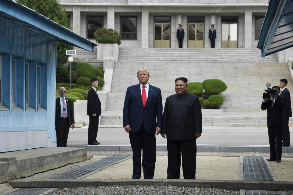 FILE - In this Sunday, June 30, 2019 file photo, U.S. President Donald Trump, center left, and North Korean leader Kim Jong Un stand on the North Korean side of the Demilitarized Zone in Panmunjom. On Friday, July 5, 2019, The Associated Press reported on stories circulating online incorrectly asserting Trump walked into North Korea by himself, without Secret Service or military protection. At background left is Special Agent in Charge Anthony Ornato. (AP Photo/Susan Walsh)