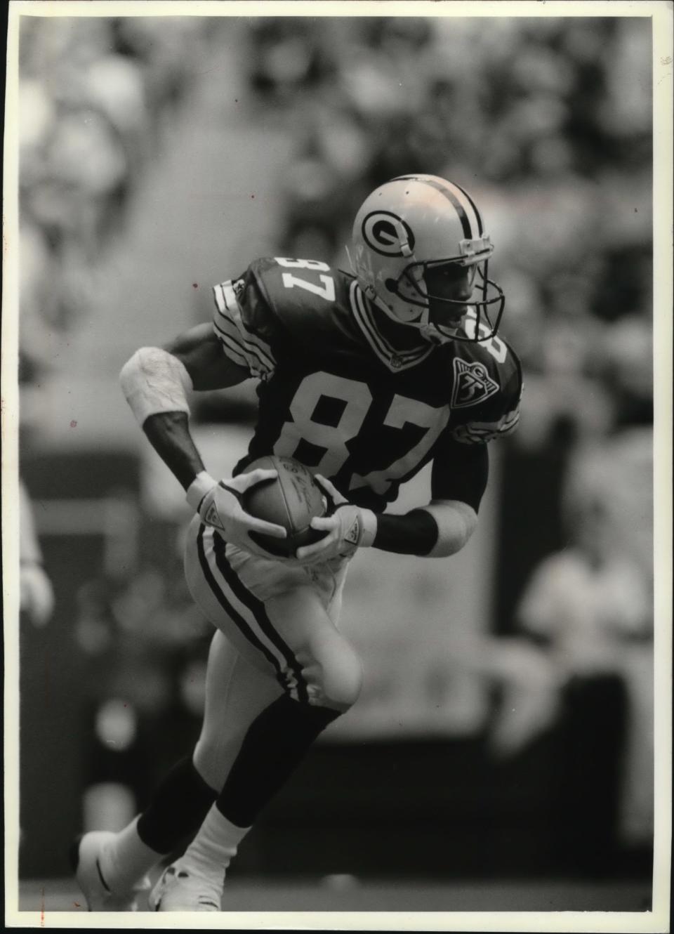 Robert Brooks returns a kickoff for touchdown in 1993.