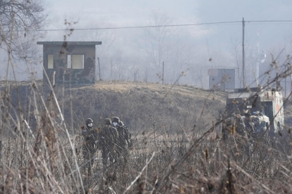 South Korean army soldiers are seen in Paju, near the border with North Korea, South Korea, Thursday, Jan. 27, 2022. North Korea on Thursday fired at least two suspected ballistic missiles into the sea in its sixth round of weapons launches this month, South Korea's military said. (AP Photo/Ahn Young-joon)