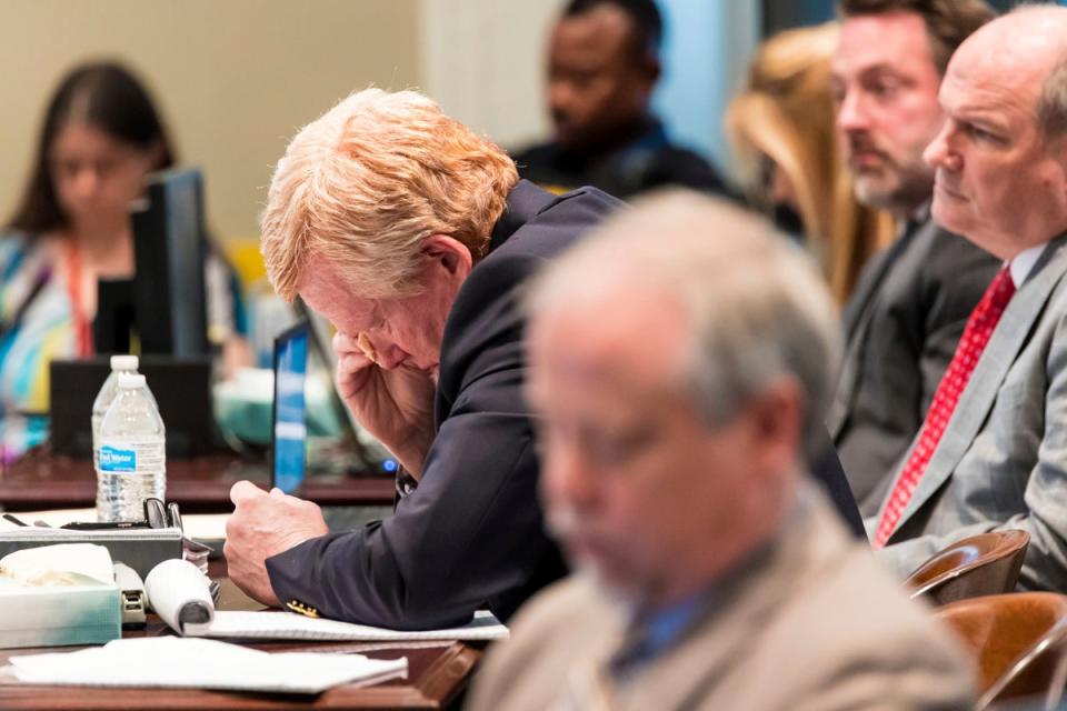 Alex Murdaugh wipes his eyes as the court is shown grisly photos of his wife and son’s bodies ((Jeff Blake/The State via AP, Pool))