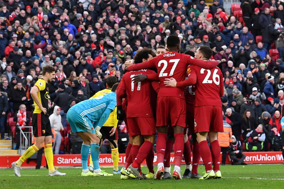 Liverpool's Egyptian midfielder Mohamed Salah celebrates with teammates. (Credit: Getty Images)