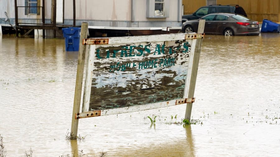 Sign in flooded waters