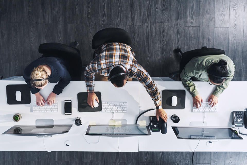 Coworkers working at their computers