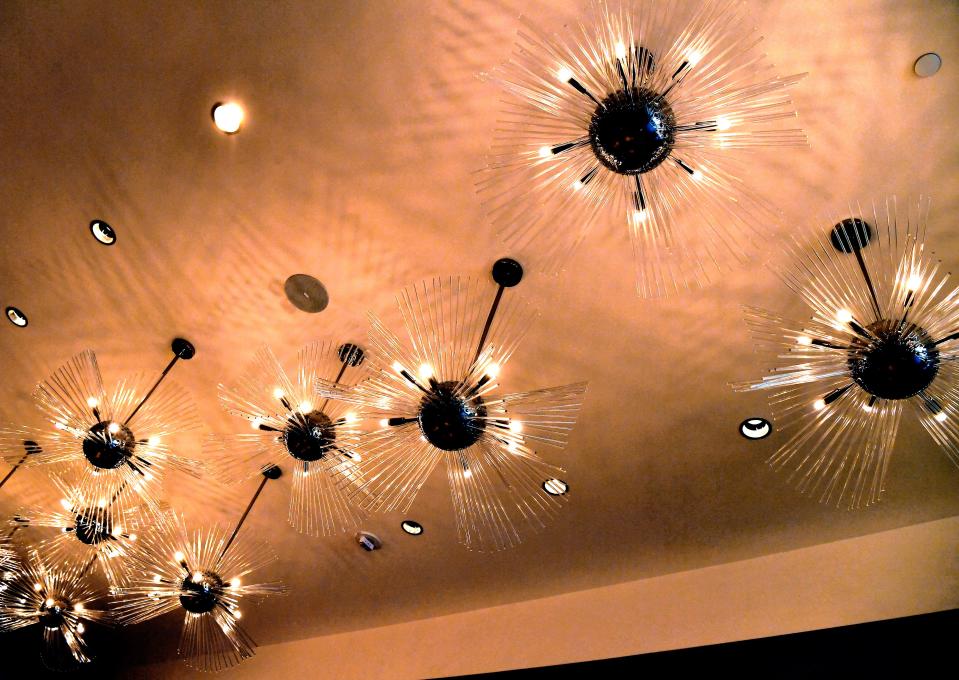 Light fixtures resembling sunbursts illuminate the lobby in the newly-opened DoubleTree by Hilton hotel.