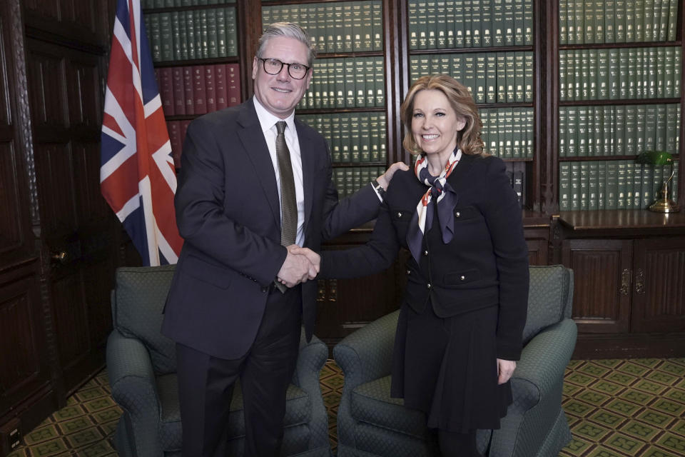 Labour leader Keir Starmer, left, shakes hands with former Conservative MP Natalie Elphicke in his parliamentary office in the House of Commons, London, Wednesday May 8, 2024. British Prime Minister Rishi Sunak was accused Wednesday of leading a “chaotic” government as another one of his Conservative lawmakers defected to the main opposition Labour Party ahead of a looming general election. In a stunning move just ahead of weekly prime minister's questions, Elphicke crossed the floor of the House of Commons to join the ranks of Starmer's Labour Party, which appears to be heading to return to power after 14 years in opposition. (Stefan Rousseau/PA via AP)