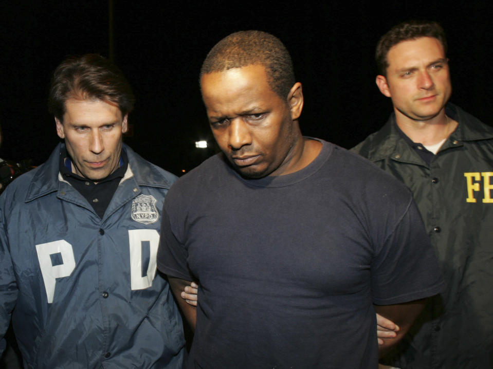 FILE - In this Thursday, May 21, 2009 picture, James Cromitie, center, is led by police officers from a federal building in New York after being arrested on charges related to a bombing plot in the Bronx. Four men snared in an infamous post-9/11 terrorism sting were ordered freed from prison Thursday, a judge finding that they had been "hapless, easily manipulated and penurious petty criminals" caught up in a plot driven by an overzealous FBI and a dodgy informant. (AP Photo/Robert Mecea, File)