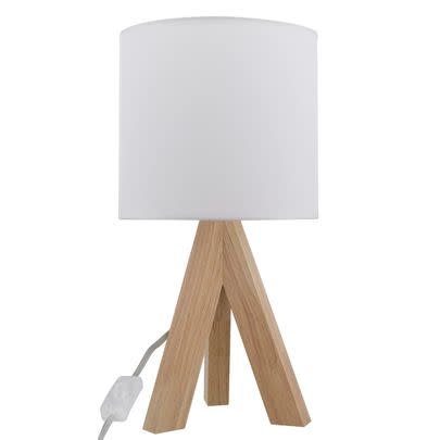 A tripod-style tamp lamp with a solid oak base