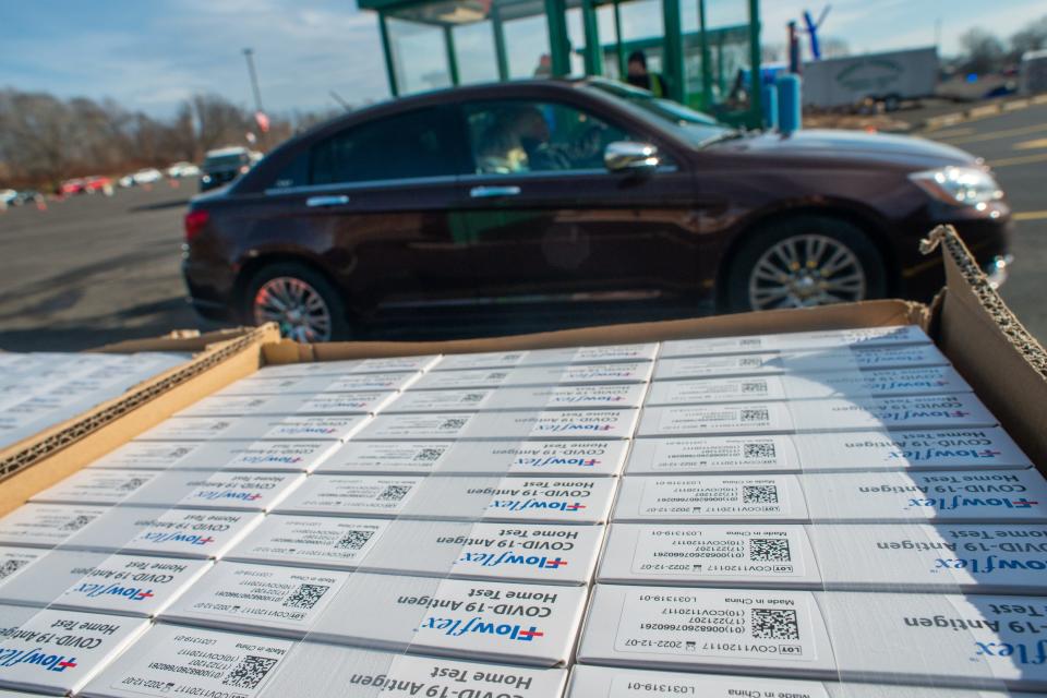 Testing kits await distribution as thousands of Bucks County residents waited in a fast moving drive through line in the parking lot to receive free COVID-19 Rapid test kits Wednesday, January 19, 2022 at Sesame Place in Langhorne. The county's Emergency Management Agency and Department of Health were expected to give out 300,000 test kits over the next few weeks from 10 a.m. to 6 p.m. each distribution day while supplies last.