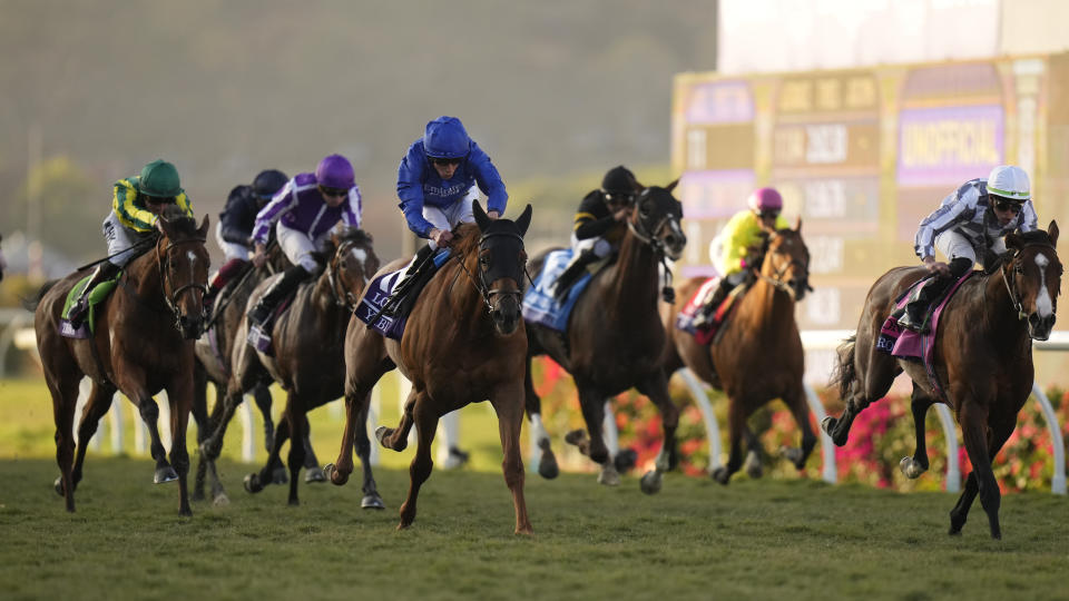 William Buick rides Yibir, middle left, to victory during the Breeders' Cup Turf race at the Del Mar racetrack in Del Mar, Calif., Saturday, Nov. 6, 2021. (AP Photo/Jae C. Hong)