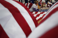 <p>A worker unfurls an American flag at the FlagSource facility in Batavia, Illinois, U.S., on Tuesday, June 27, 2017. (Photo: Jim Young/Bloomberg via Getty Images) </p>