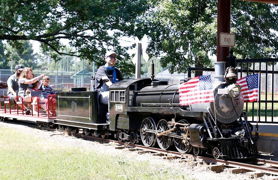 Will Turner brings the 200 Electric Steam Engine into the depot at Creekmore Park after taking the Montoya family around the track on June 30, 2022, in Fort Smith. The train operates Wednesday-Saturday, 10 a.m. to 4 p.m., and on Sundays, 1-6 p.m. until September when the schedule changes to weekend hours.