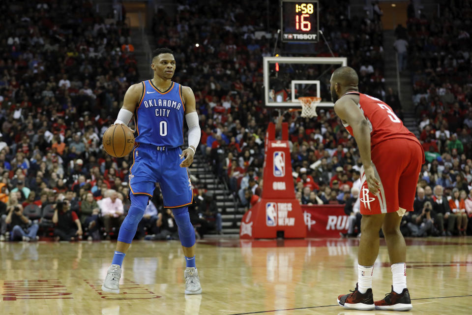 HOUSTON, TX - APRIL 07:  Russell Westbrook #0 of the Oklahoma City Thunder brings the ball down the court defended by Chris Paul #3 of the Houston Rockets in the second half at Toyota Center on April 7, 2018 in Houston, Texas.  NOTE TO USER: User expressly acknowledges and agrees that, by downloading and or using this Photograph, user is consenting to the terms and conditions of the Getty Images License Agreement.  (Photo by Tim Warner/Getty Images)