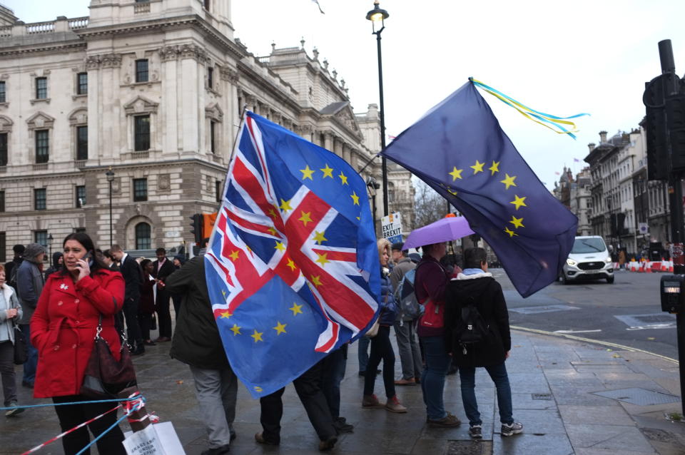 Anti Brexit demonstrators wave EU and UK flags outside at Parliament Square, as the December Brexit vote – which was subsequently delayed, approached.