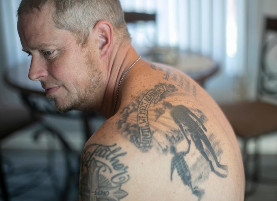 Andy Hopson, 51 of Livonia, a recovering addict, talks about the loss of his son Dakota, who died on May, 5, 2016 of a heroin overdose. He had many tatoos memorializing his son including a likeness of them walking hand-in-hand.