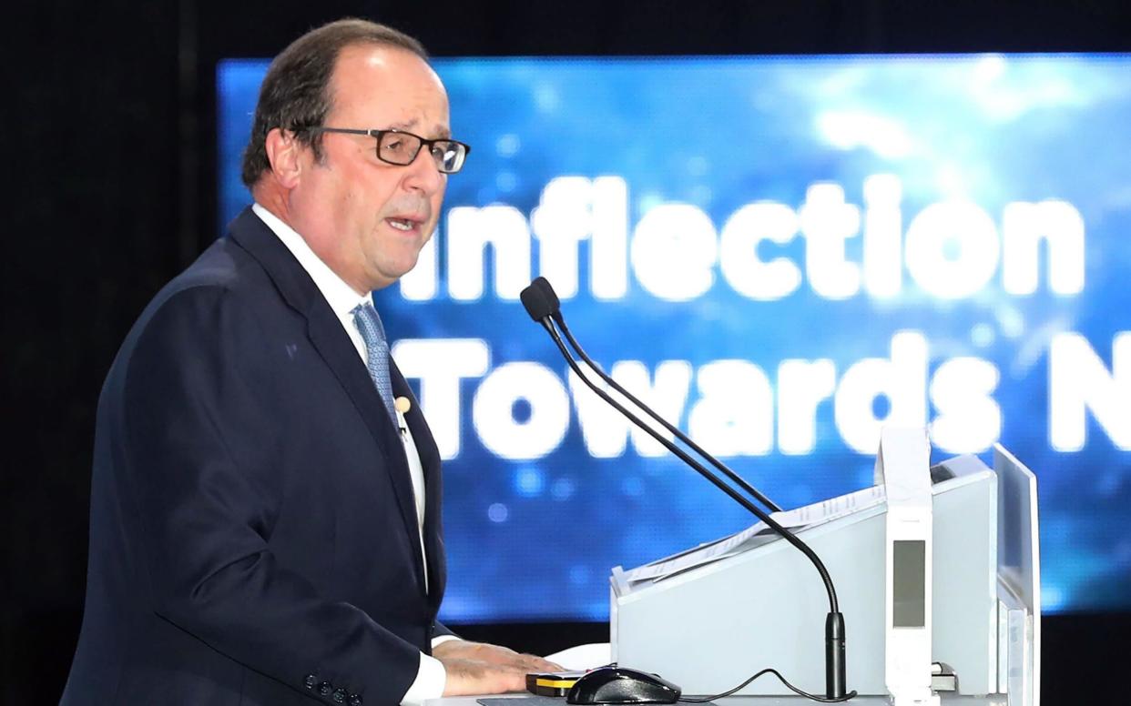 Former French president Francois Hollande speaking at the opening ceremony of the World Knowledge Forum in Seoul - AFP