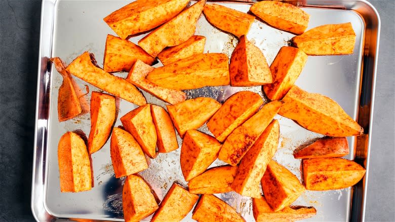 Roasted sweet potato wedges on pan 