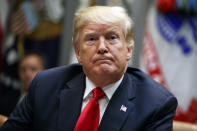 President Donald Trump listens to a question from a reporter during a meeting of the President's National Council of the American Worker in the Roosevelt Room of the White House, Monday, Sept. 17, 2018, in Washington. (AP Photo/Evan Vucci)