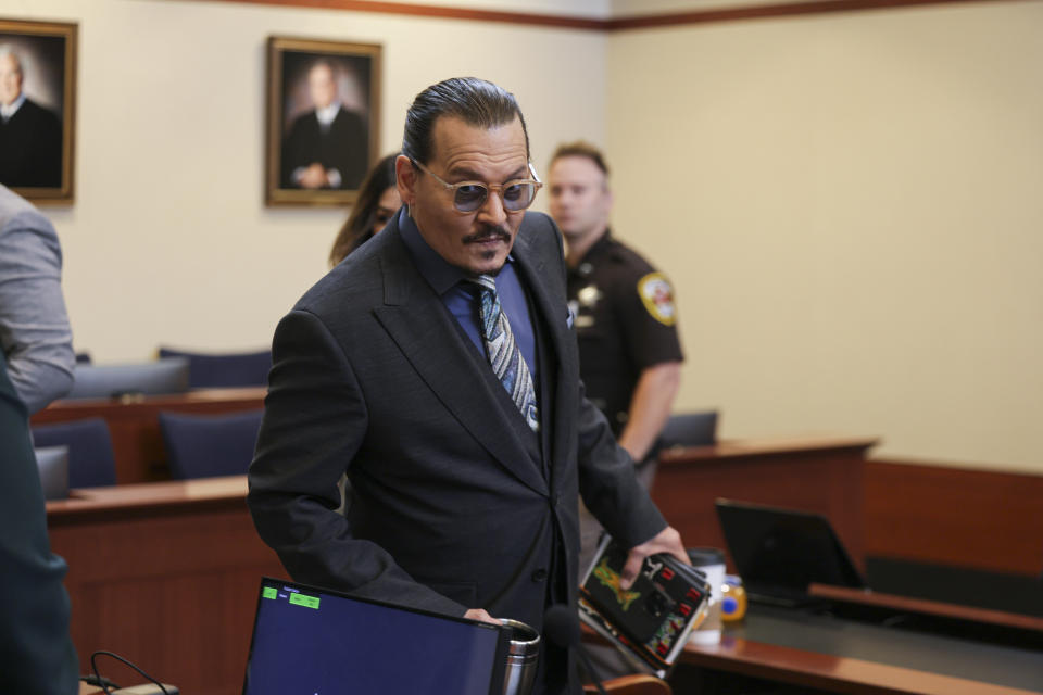 Actor Johnny Depp arrives at the Fairfax County Circuit Courthouse in Fairfax, Va., Wednesday, May 25, 2022. Depp sued his ex-wife Amber Heard for libel in Fairfax County Circuit Court after she wrote an op-ed piece in The Washington Post in 2018 referring to herself as a "public figure representing domestic abuse." (Evelyn Hockstein/Pool photo via AP)