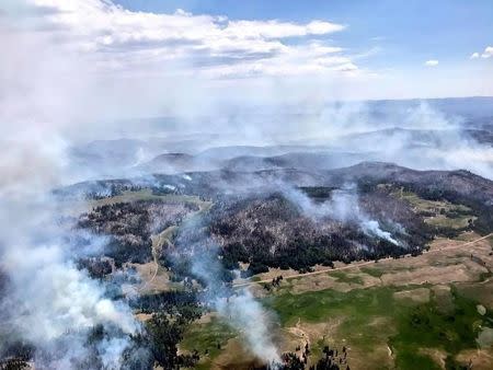 An aerial photo of wildfires burning across almost 50,000 acres near the ski resort of Brian Head, about 245 miles south of Salt Lake City, Utah is shown in this handout photo provided June 27, 2017. Courtesy Lt. Governor Spencer J Cox/Handout via REUTERS ATTENTION EDITORS - THIS IMAGE WAS PROVIDED BY A THIRD PARTY.