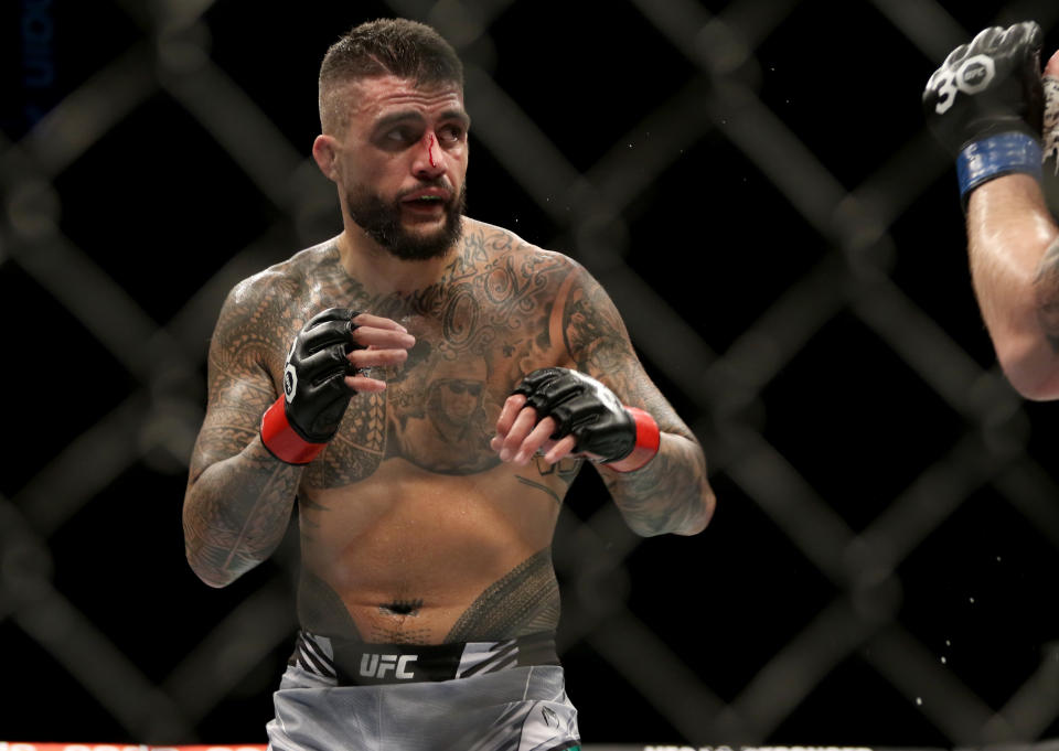 Feb 12, 2023; Perth, WA, AUSTRALIA; Tyson Pedro (red gloves) fights Modestas Bukauskas (blue gloves) during UFC 284 at RAC Arena. Mandatory Credit: Jasmin Frank-USA TODAY Sports